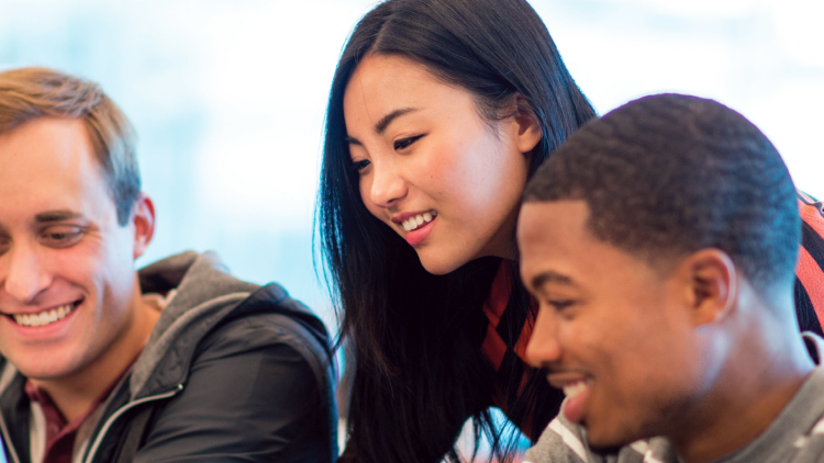 College students working on a project together